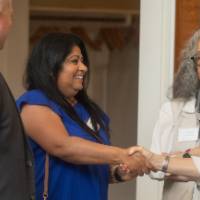 faculty greeting each other